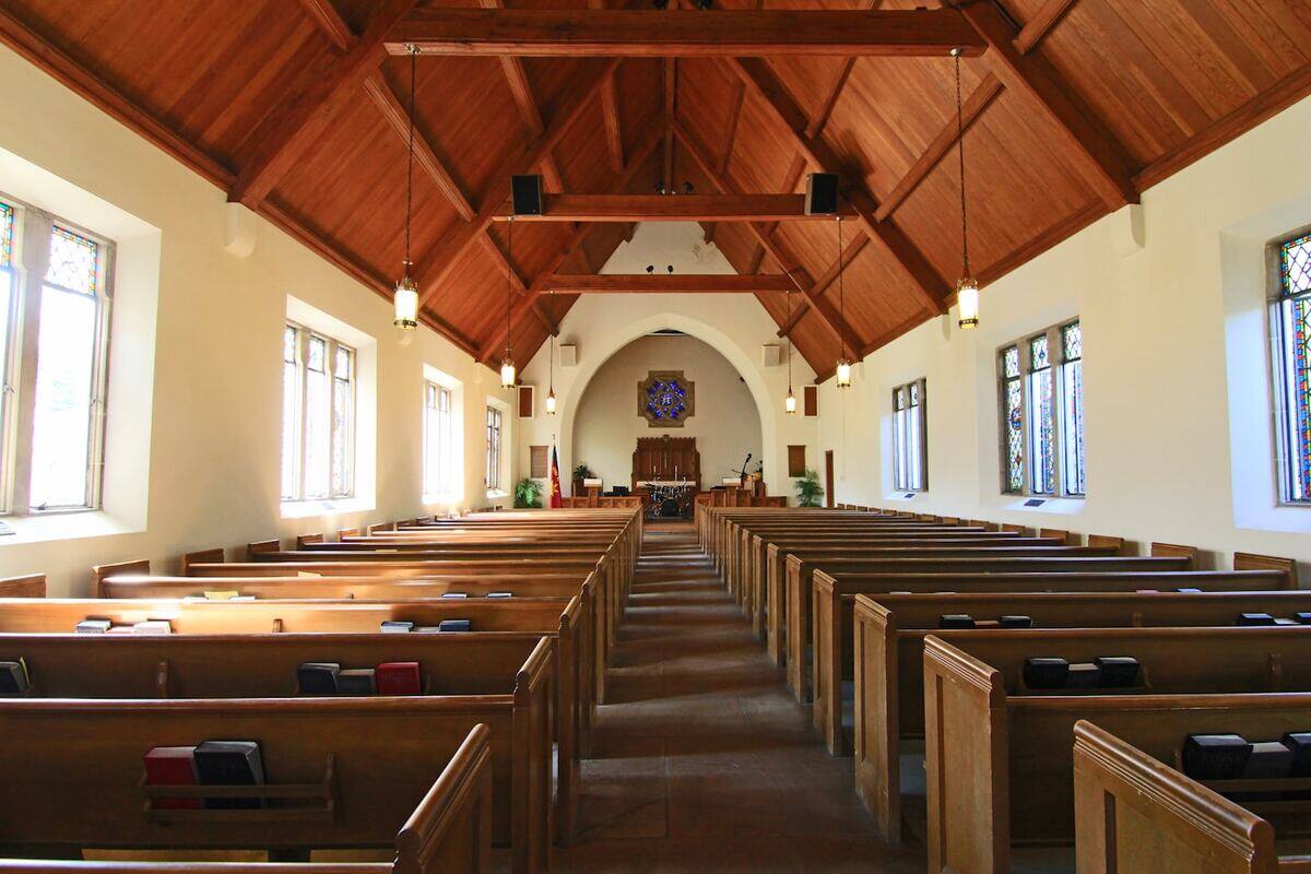 Congregation seated in a softly lit gathering space
