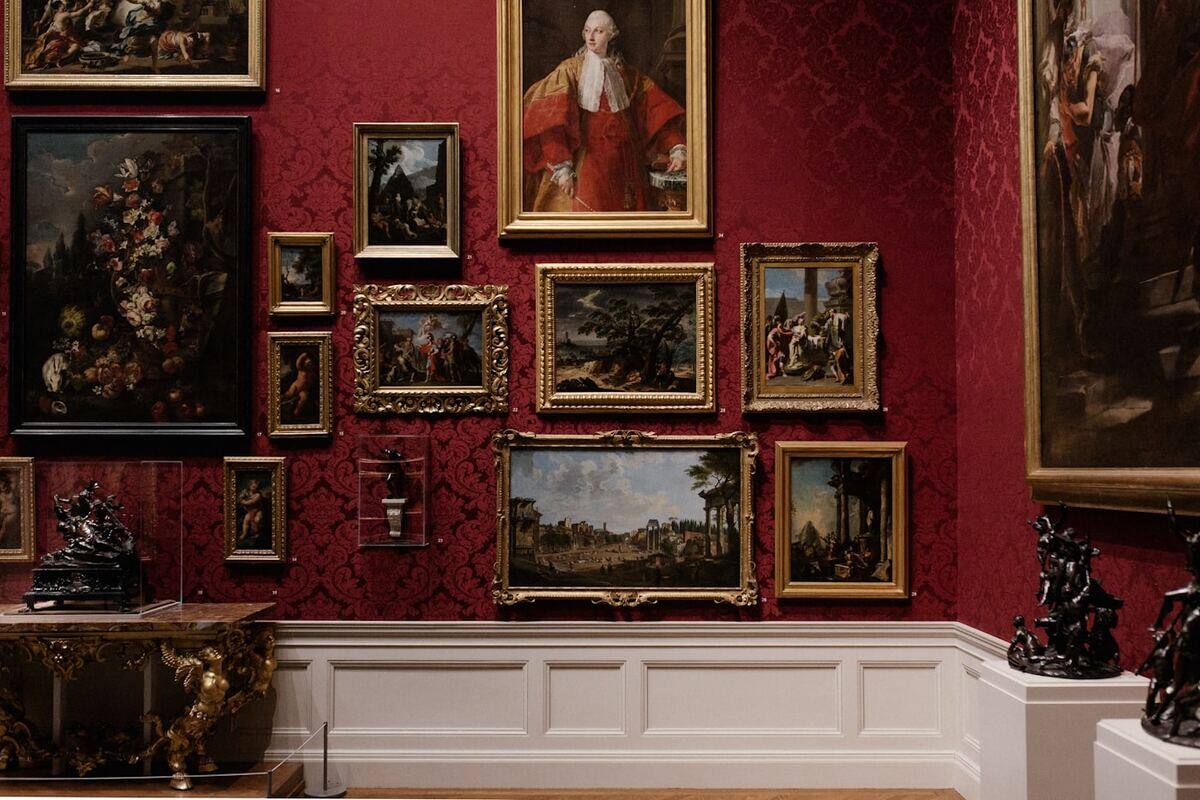 Museum visitors walking through a gallery exhibition